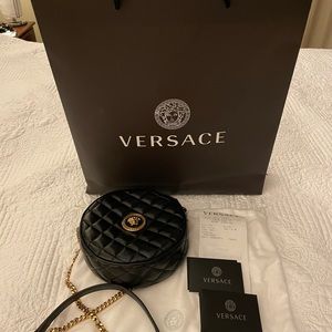 Versace black leather crossbody bag.